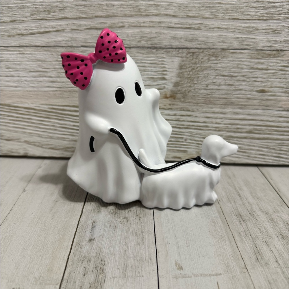 White Ghost walking dog Figurine with Pink Bow

Very small 4 by 5 inches